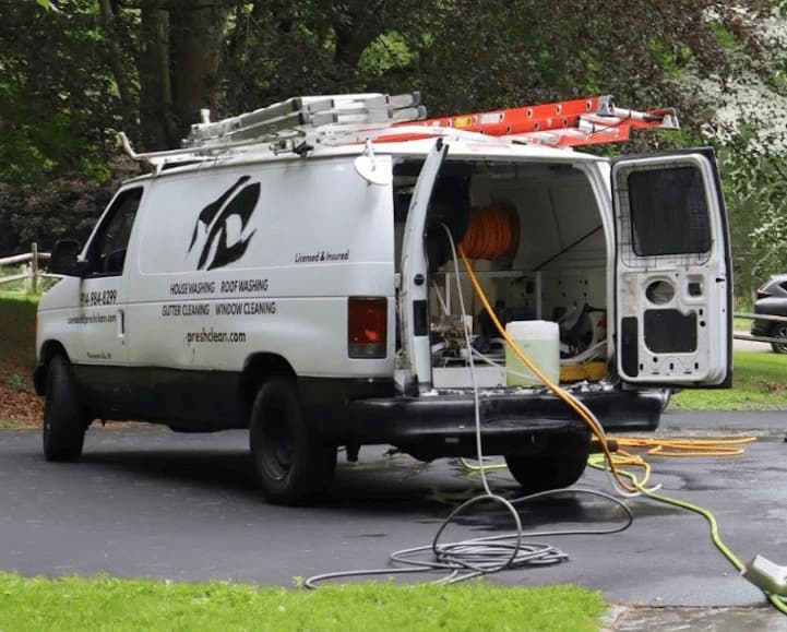 Green Power Washing professionals cleaning commercial fleet in Green